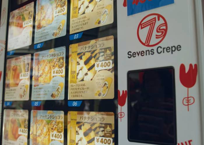 A Seven's Crepe vending machine, showing the different flavors available for purchase.